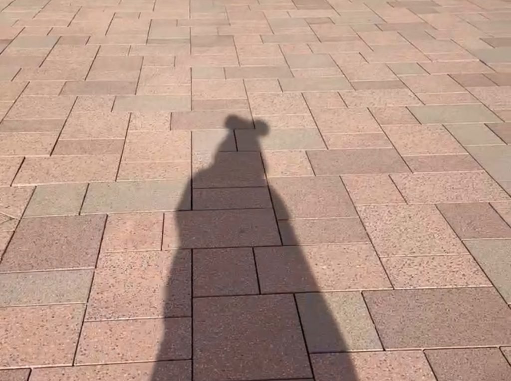 Shadow on the ground outside the Disneyalnd Paris Tickets office